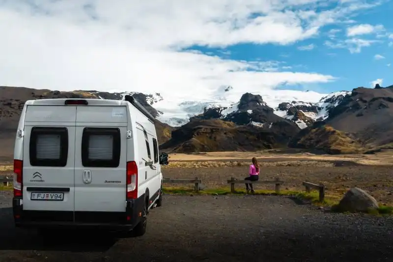 RV parked next to a glacier in Iceland